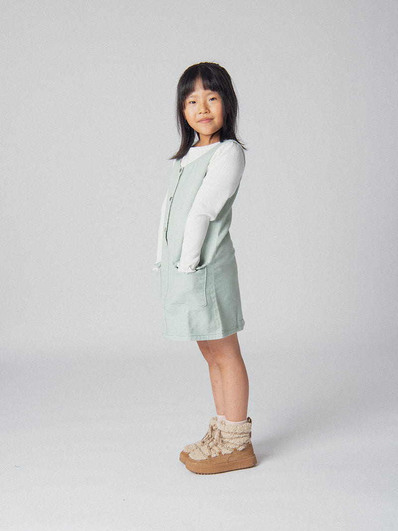 Robe verte sauge à poches pour fille