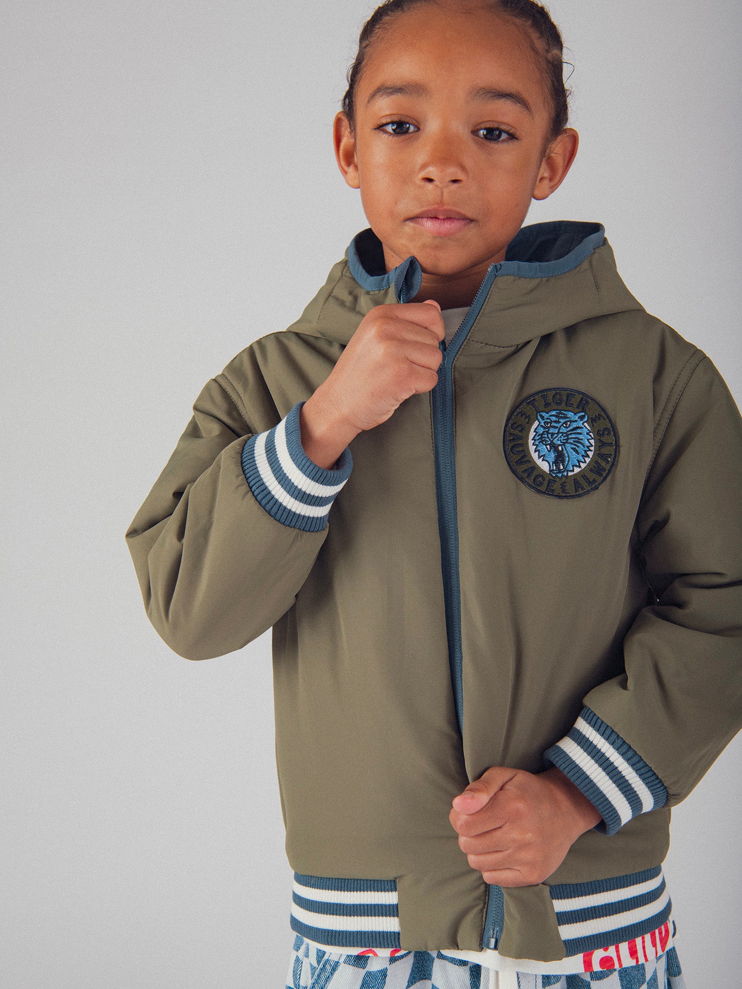 Blouson réversible bleu et vert pour garçon