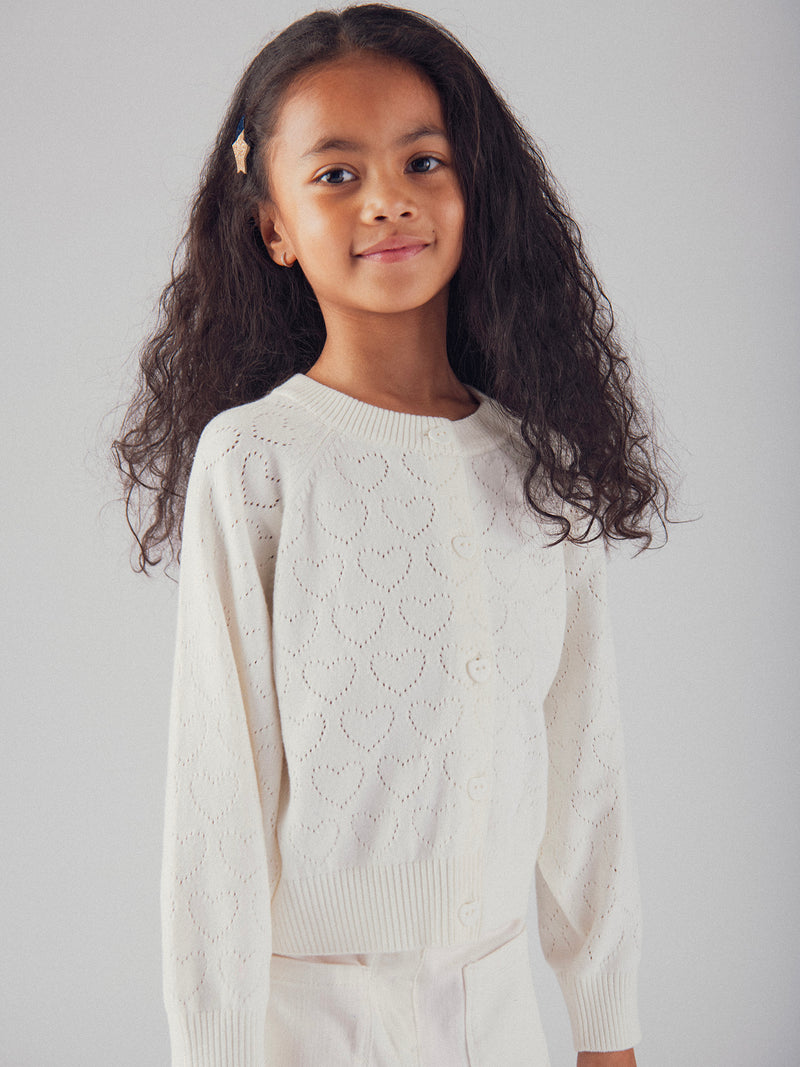 Cardigan blanc cassé ajourée coeur pour fille