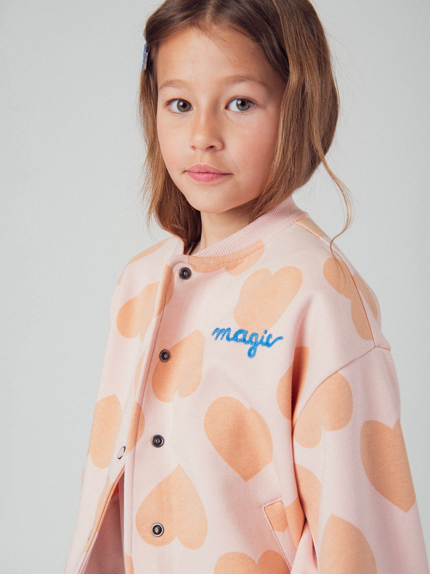 Gilet rose à imprimé coeur pour fille